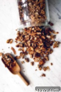 Homemade banana bread granola in a glass jar, ready to be enjoyed.