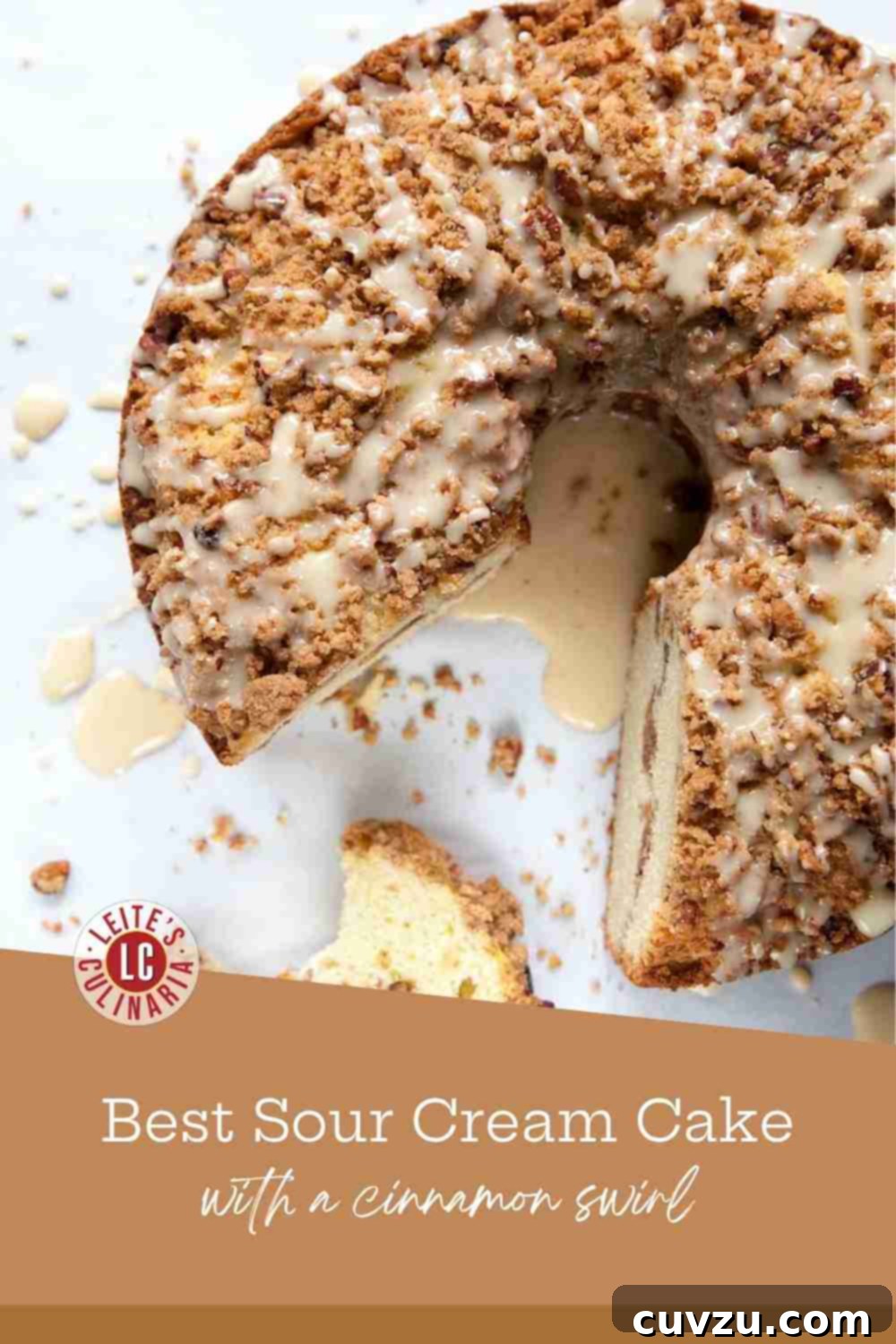 Lush Sour Cream Coffee Cake 3 A tall, moist slice of sour cream coffee cake, clearly displaying the rich layers of cinnamon-pecan streusel throughout.