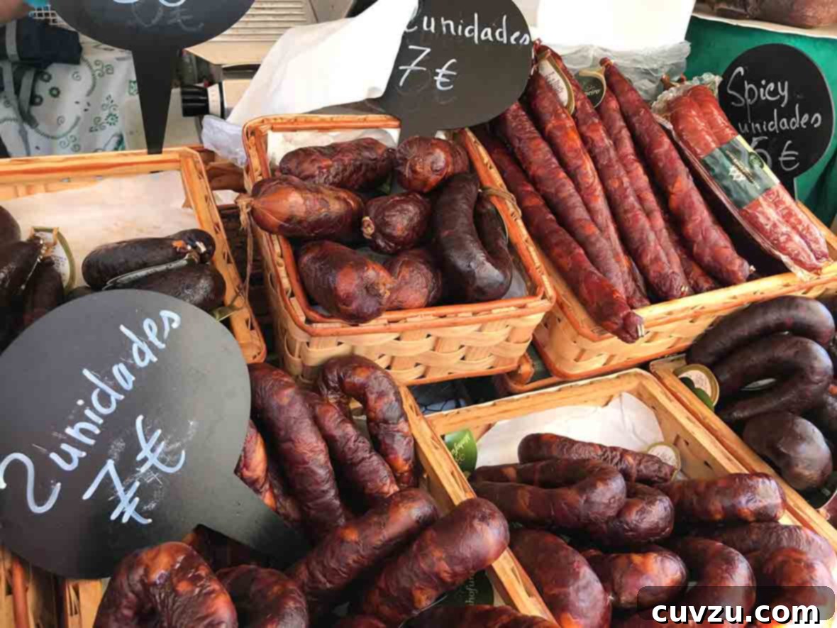 Lisbon's Golden Homecoming 8 A vibrant stall in a bustling Lisbon food market, showcasing an array of authentic Portuguese sausages, a true taste of local culinary tradition.