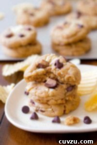 A plate of chocolate chip cookies with with potato chips and toffee pieces baked in