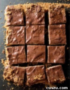 A tray of coconut candy bars cut into squares.