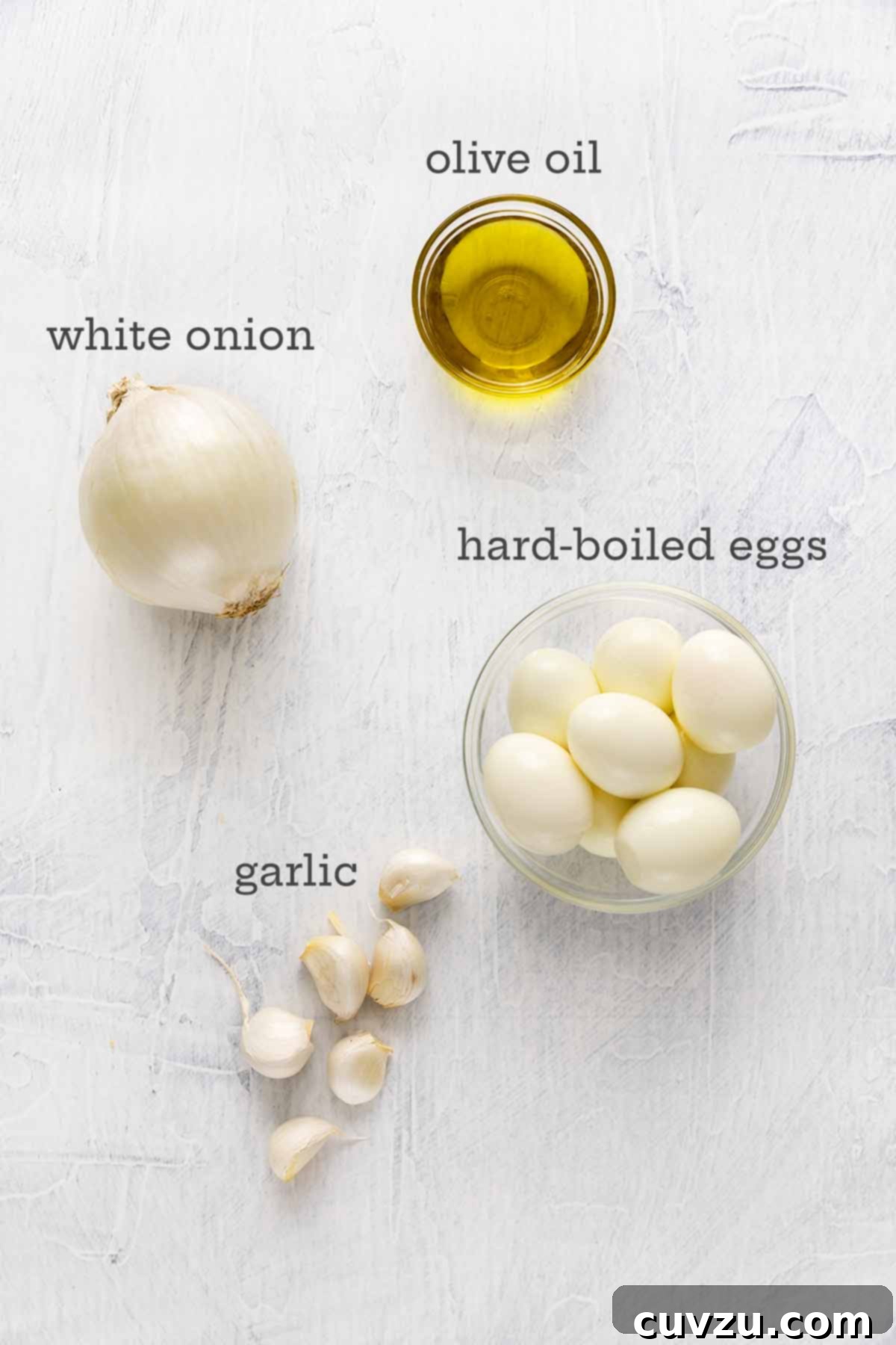 Egg Salad Reinvented 5 Ingredients for egg salad without mayo--olive oil, onion, garlic, and hard-boiled eggs.