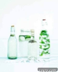 Four bottles of infused water prepared using the instructions on how to infuse water.