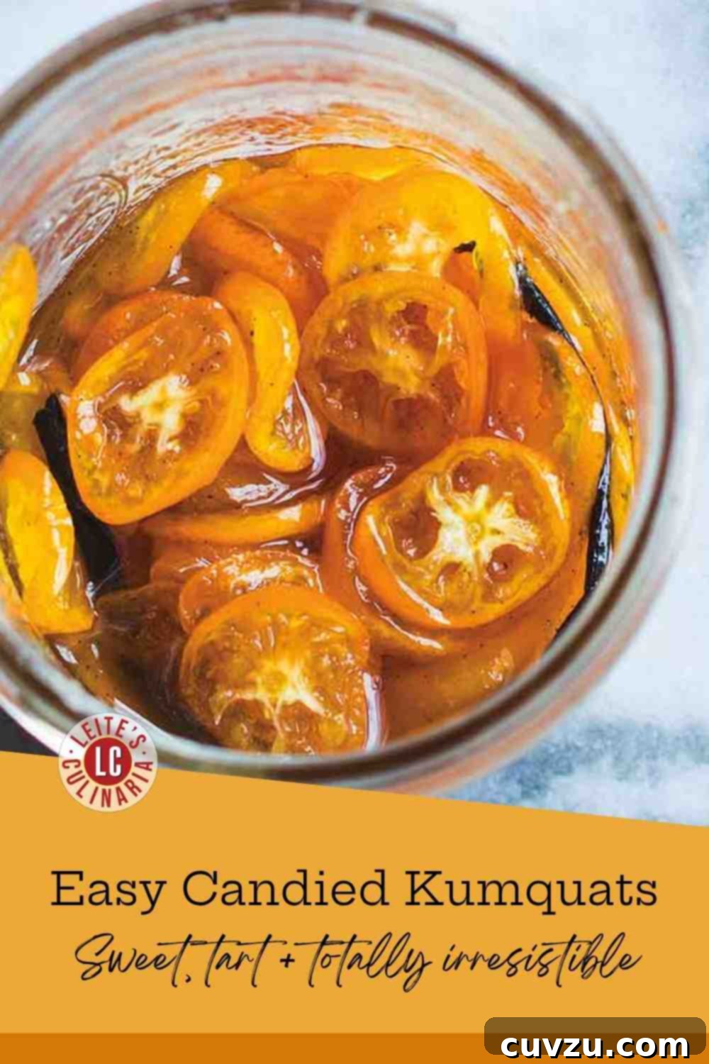 Zesty Glazed Kumquats 3 Close-up of bright orange candied kumquat slices in a small white bowl with honey-vanilla syrup, glistening.