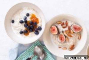 Ancient Grains Porridge 3 Two white bowls filled with porridge; one topped with blueberries and the other with figs and almonds.