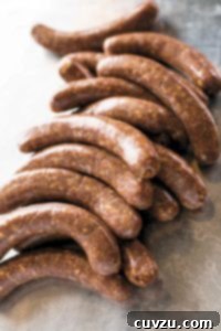 Links of spicy homemade chorizo, a blend of Mexican and Spanish flavors, ready for cooking.
