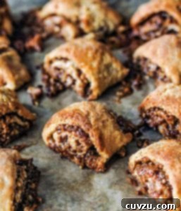 Southern Pecan Rugelach 4 A dozen golden brown pecan pie rugelach with filling oozing out