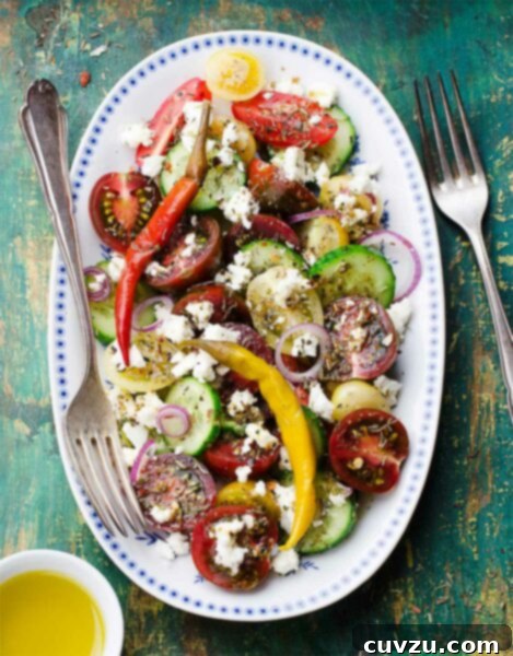A close-up of the Greek salad on a platter, showcasing the freshness of the ingredients.
