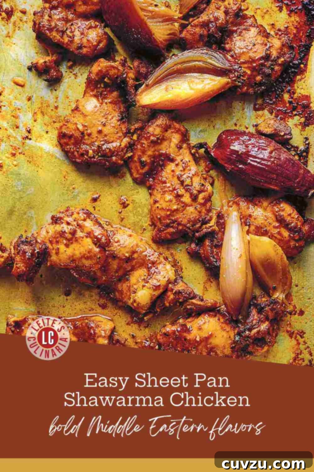 Flavorful Chicken Shawarma Wraps 3 Spiced chicken thighs and roasted red onions fresh from the oven on a baking sheet.