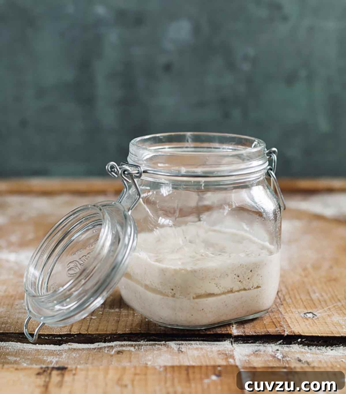 Crafting Your Sourdough Magic 8 A clean glass jar freshly filled with a new, active sourdough starter, ready for ongoing maintenance.