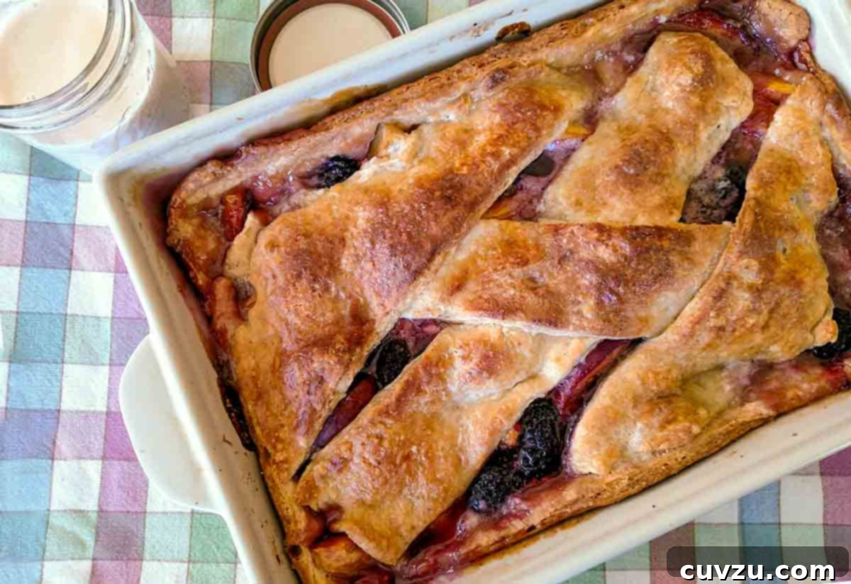 Luscious Peach Berry Sonker 5 A beautifully baked peach berry sonker in a square baking dish, captured by Chiyo Ueyama.