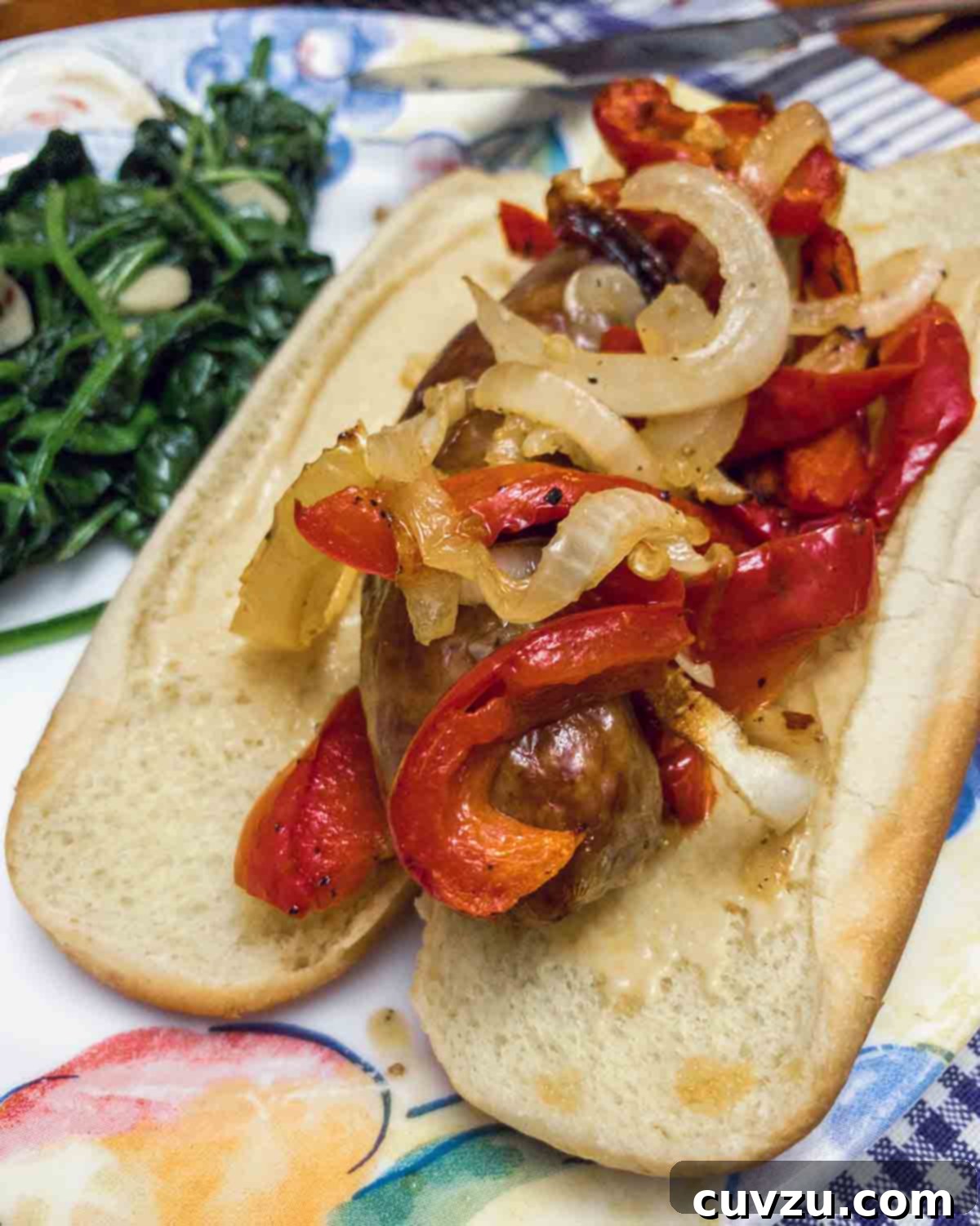 One-Pan Sausage & Pepper Wonder 5 A perfectly roasted sheet pan sausage, peppers, and onions on a plate, ready to be enjoyed, showcasing the rich colors and caramelized edges.