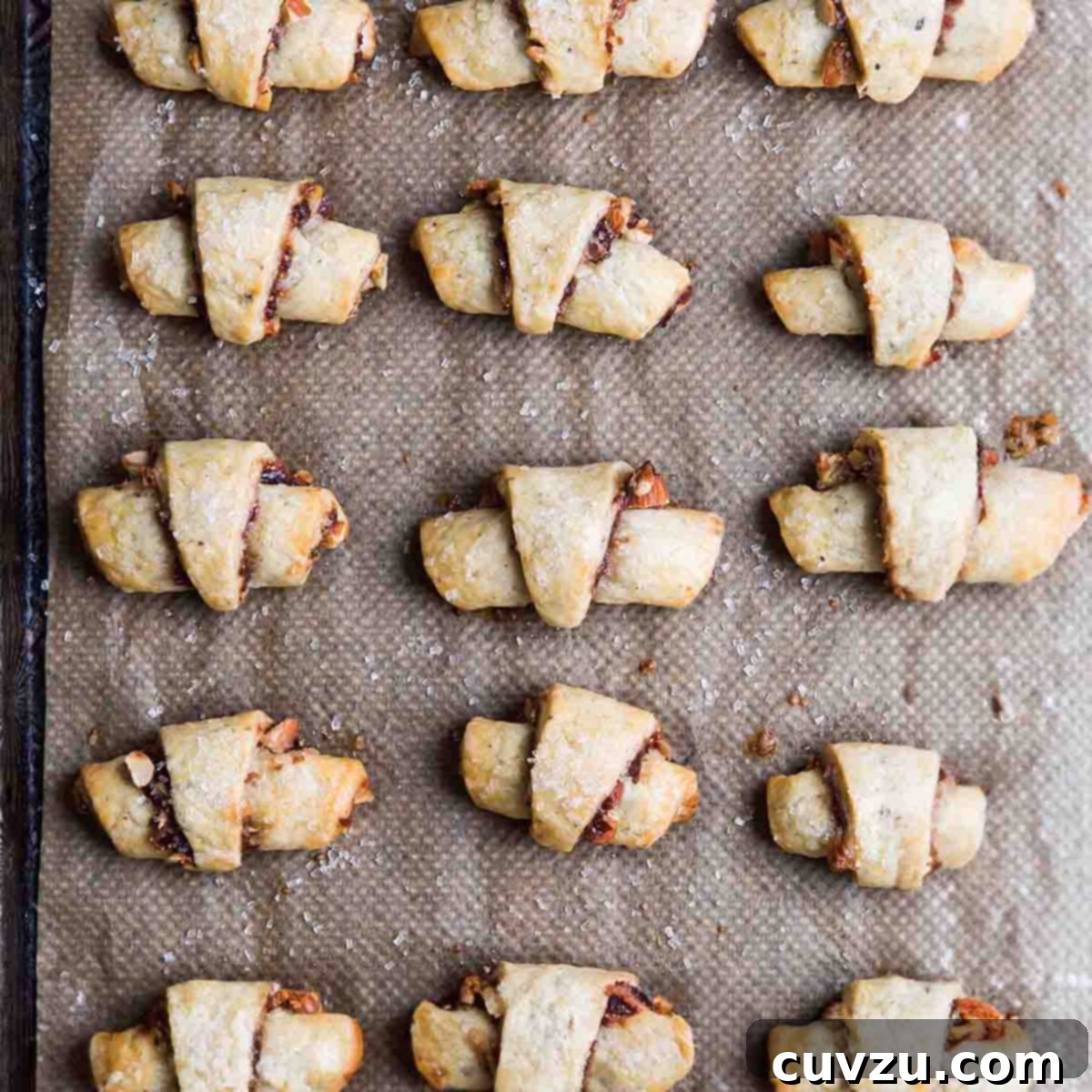 Light Up Your Table: 11 Hanukkah Recipes 11 A baking sheet with four rows of baked fig rugelach.