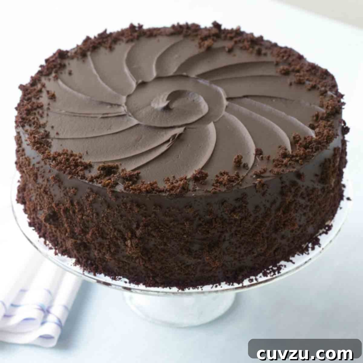 A blackout cake from Ebinger's on a cake stand.