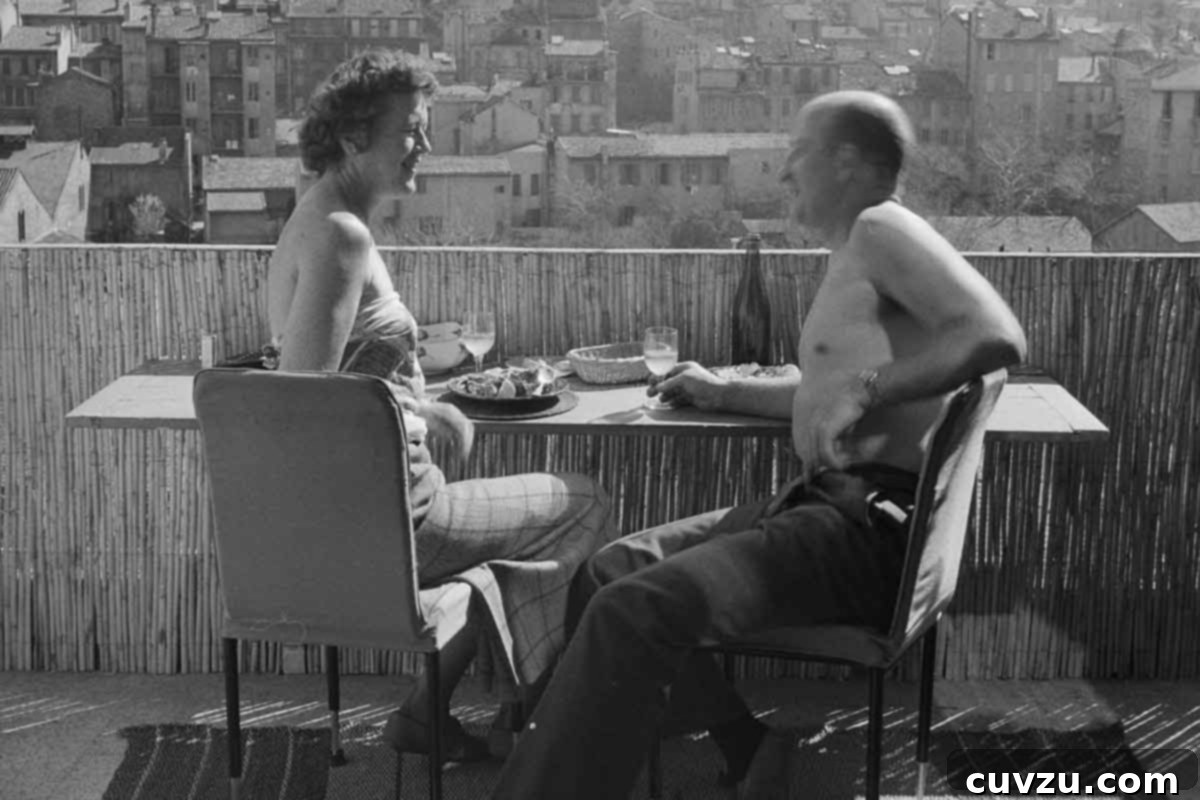Julia Child Cooks Up a Series for HBO Max 3 Julia Child and Paul Child at a table overlooking the city with wine and food.
