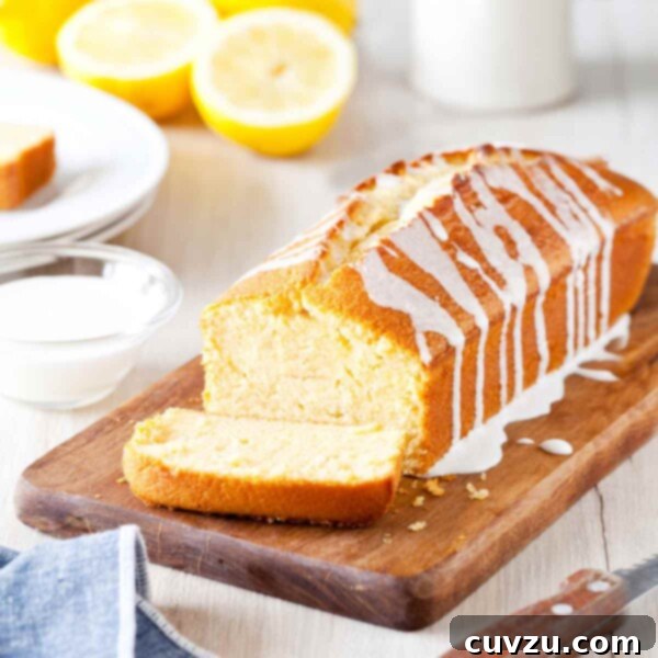 Barefoot Contessa's Lemon Sunshine Slice 3 Ina Garten's lemon cake, a pound cake, on a cutting board, drizzled with a lemon glaze