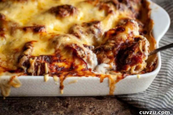 A freshly baked Croque Monsieur casserole, golden and beautifully puffed, with melted cheese glistening on top, perfect for serving.
