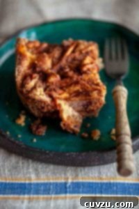 A square of Passover apple cake on a green plate.