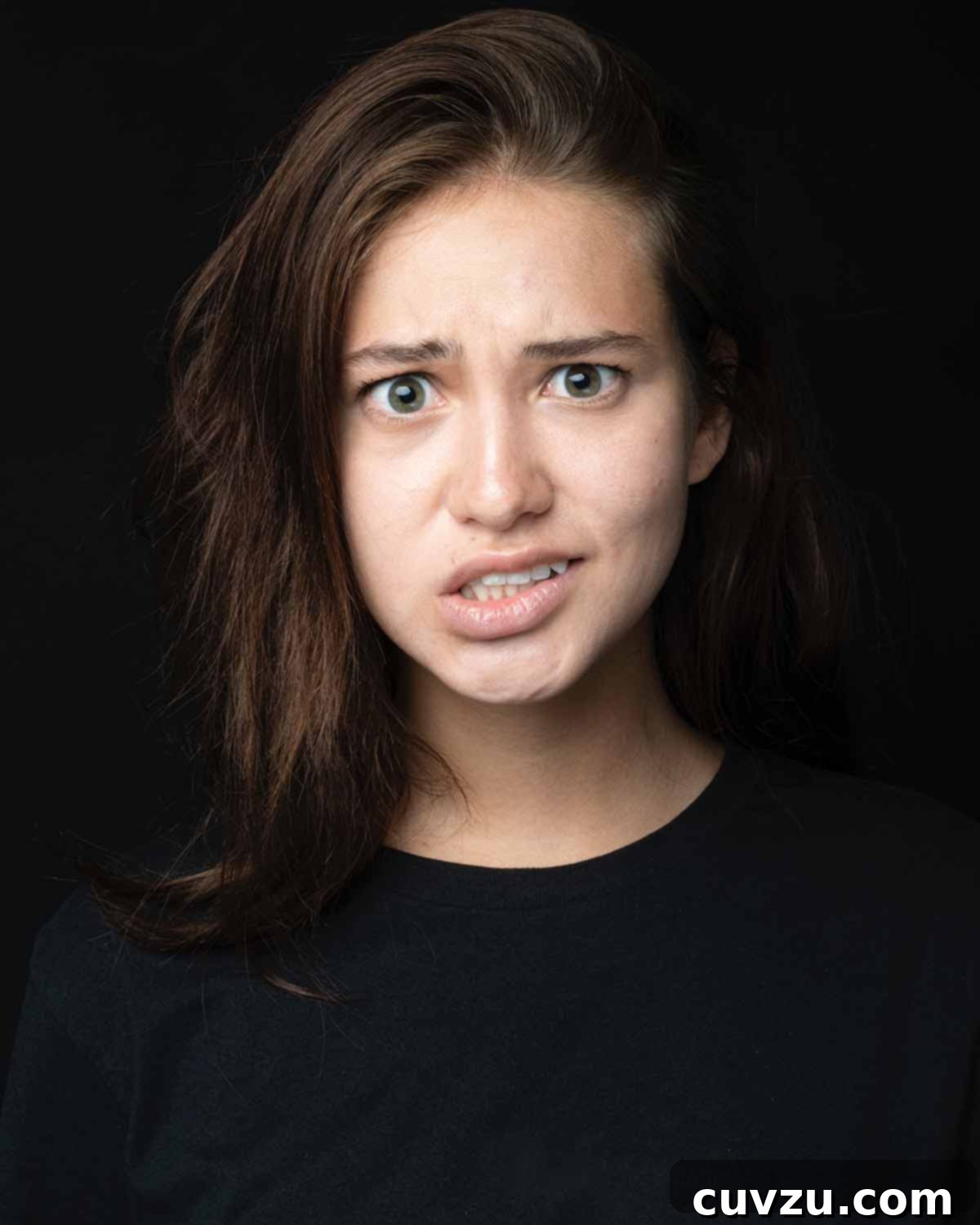 My First Air Fryer Test: The Unexpected Results 5 A young woman with a puzzled expression, contemplating choices or decisions.