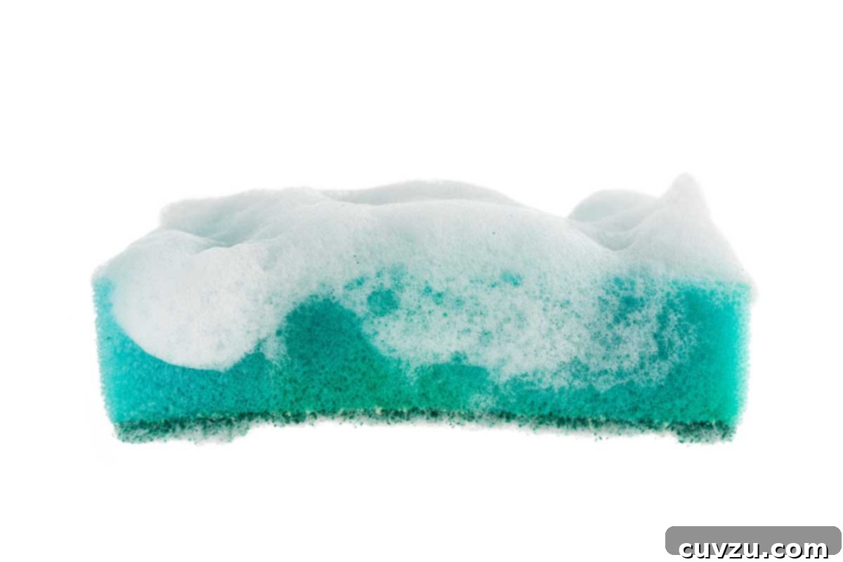 My First Air Fryer Test: The Unexpected Results 7 A vibrant sponge covered in soap suds, ready for cleaning.