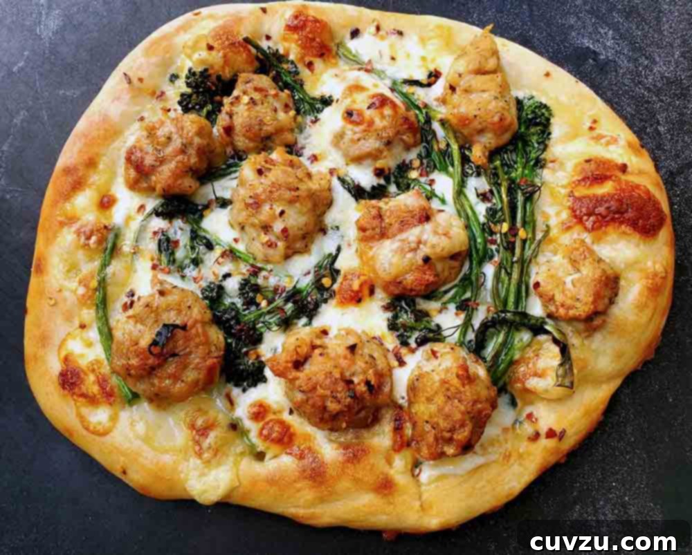 An individual sized white pizza with broccolini, fontina, and sausage.