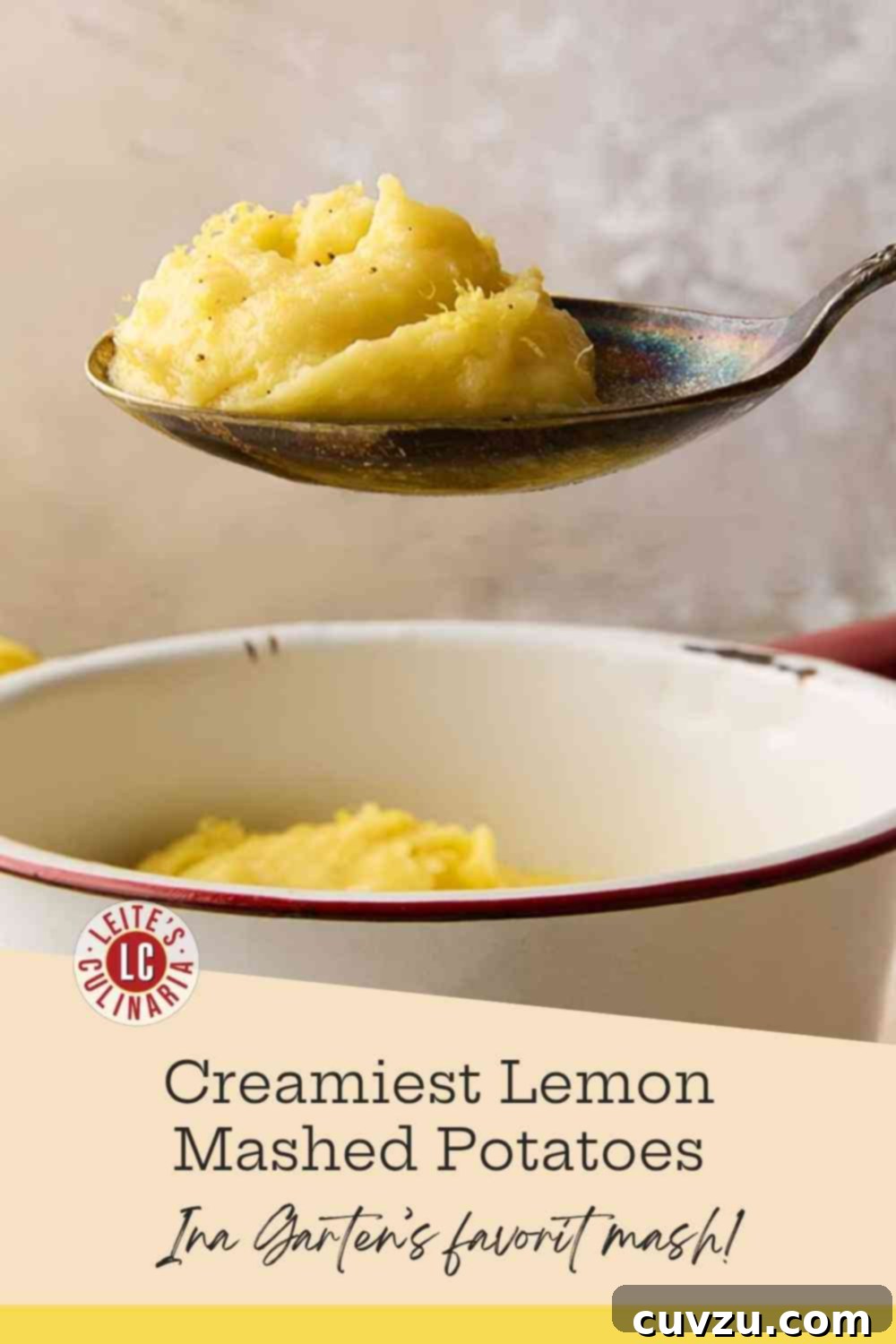 Ina Gartens Bright Lemony Mashed Potatoes 3 A pristine white enamel pot brimming with rich, velvety mashed potatoes, generously topped with freshly ground black pepper and bright yellow lemon zest.