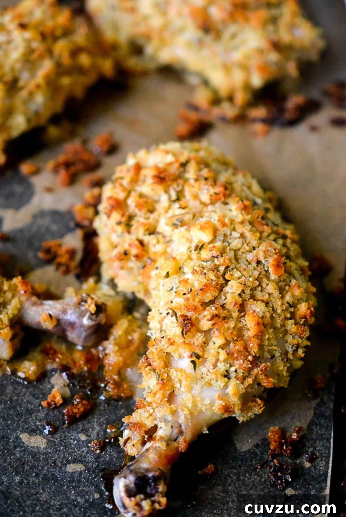 Ina Garten Chicken breaded and cooked on a sheet pan, showcasing a crispy mustard coating.
