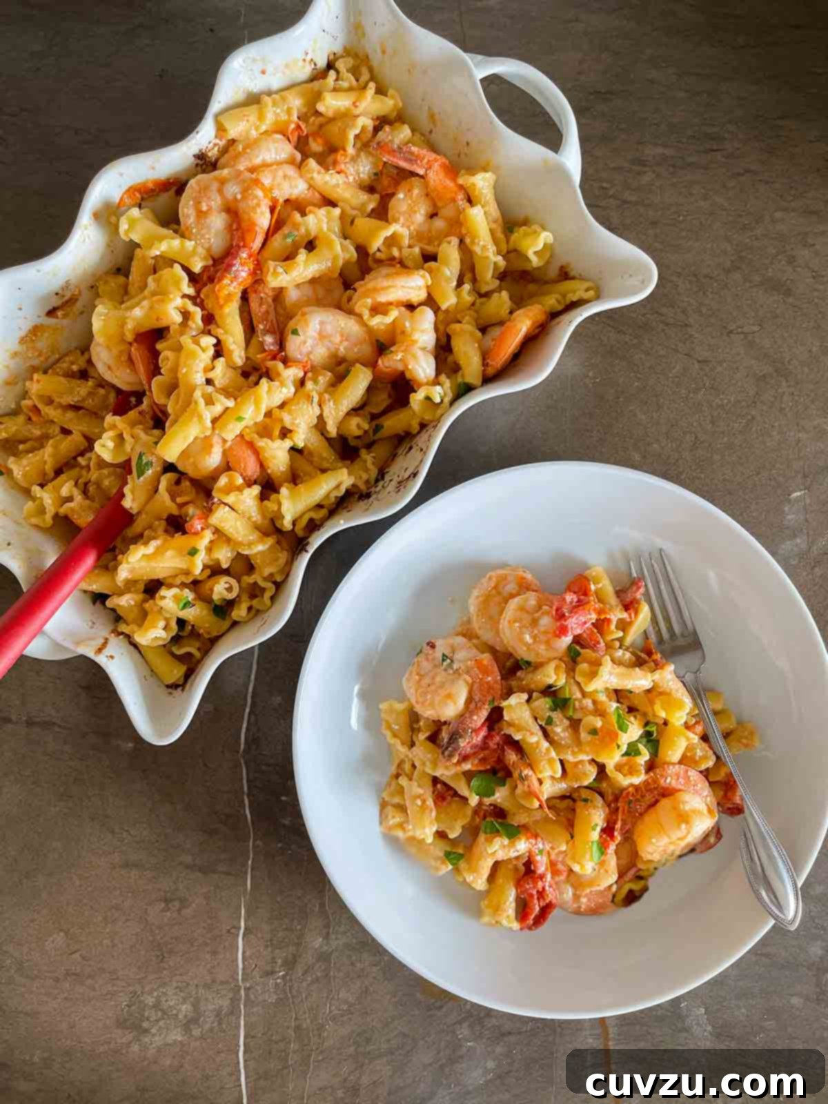 Creamy Feta and Shrimp Pasta Bake 2 A beautifully plated dish of baked feta pasta with shrimp, cherry tomatoes, and fresh herbs, ready to be enjoyed.