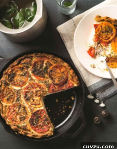Savory Tomato Ricotta Tart 3 A cast-iron skillet filled with a tomato ricotta pie, one slice missing. Next to it, a white plate with a half eaten slice of pie.
