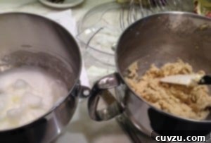 Rainbow Cookies batter in stand mixer bowls.