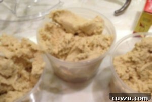 Rainbow Cookies batter divided into 3 plastic containers.