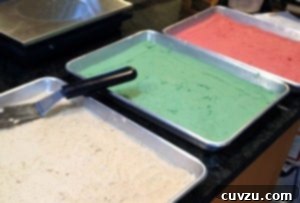 Rainbow Cookies batter divided between 3 baking sheets.