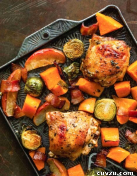 Roasted Chicken, Apple, Bacon, and Brussels Medley 3 A sheet pan filled with roasted chicken thighs, apples, bacon, Brussels sprouts, and sweet potatoes.