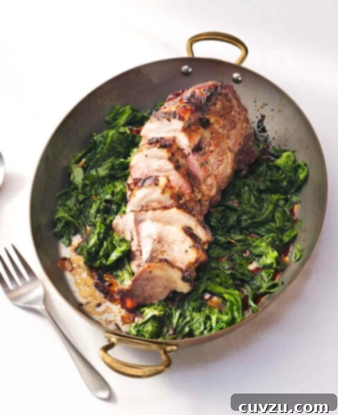 Golden Mustard Pork Shoulder Roast 3 Roasted pork shoulder with mustard glaze on a bed of wilted mustard greens with sweet potatoes and a serving fork, a truly enticing meal.