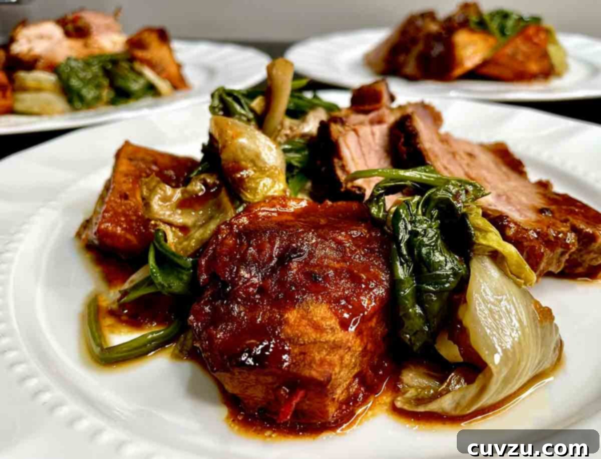 Golden Mustard Pork Shoulder Roast 5 Three beautifully plated servings of roasted pork shoulder with mustard glaze, accompanied by vibrant wilted greens.