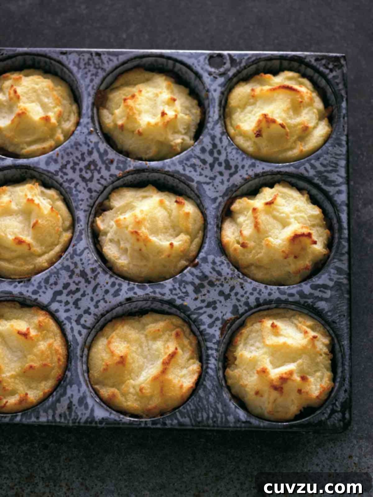 Beyond the Sandwich: 9 Epic Thanksgiving Leftover Ideas 8 A muffin tin filled with cooked Thanksgiving leftovers muffins.