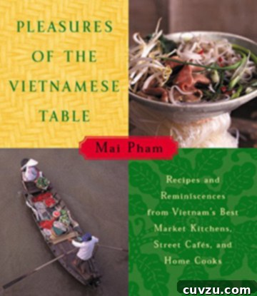 Book cover for Pleasures of the Vietnamese Table by Mai Pham, featuring a vibrant culinary scene.