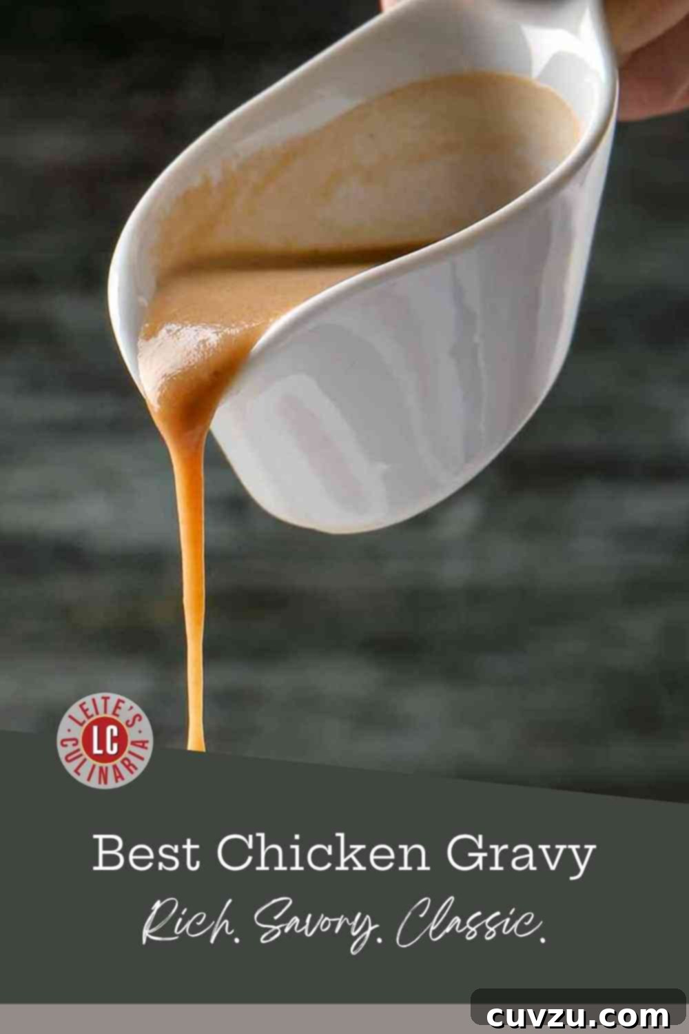 Rich, golden-brown chicken gravy pouring into a pristine white porcelain boat, signaling deliciousness ahead.