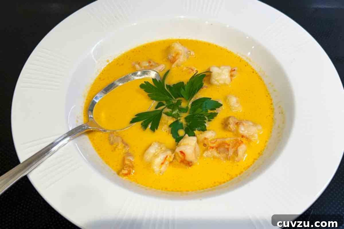 Exquisite Shrimp Bisque 5 Two bowls of shrimp bisque on a black table