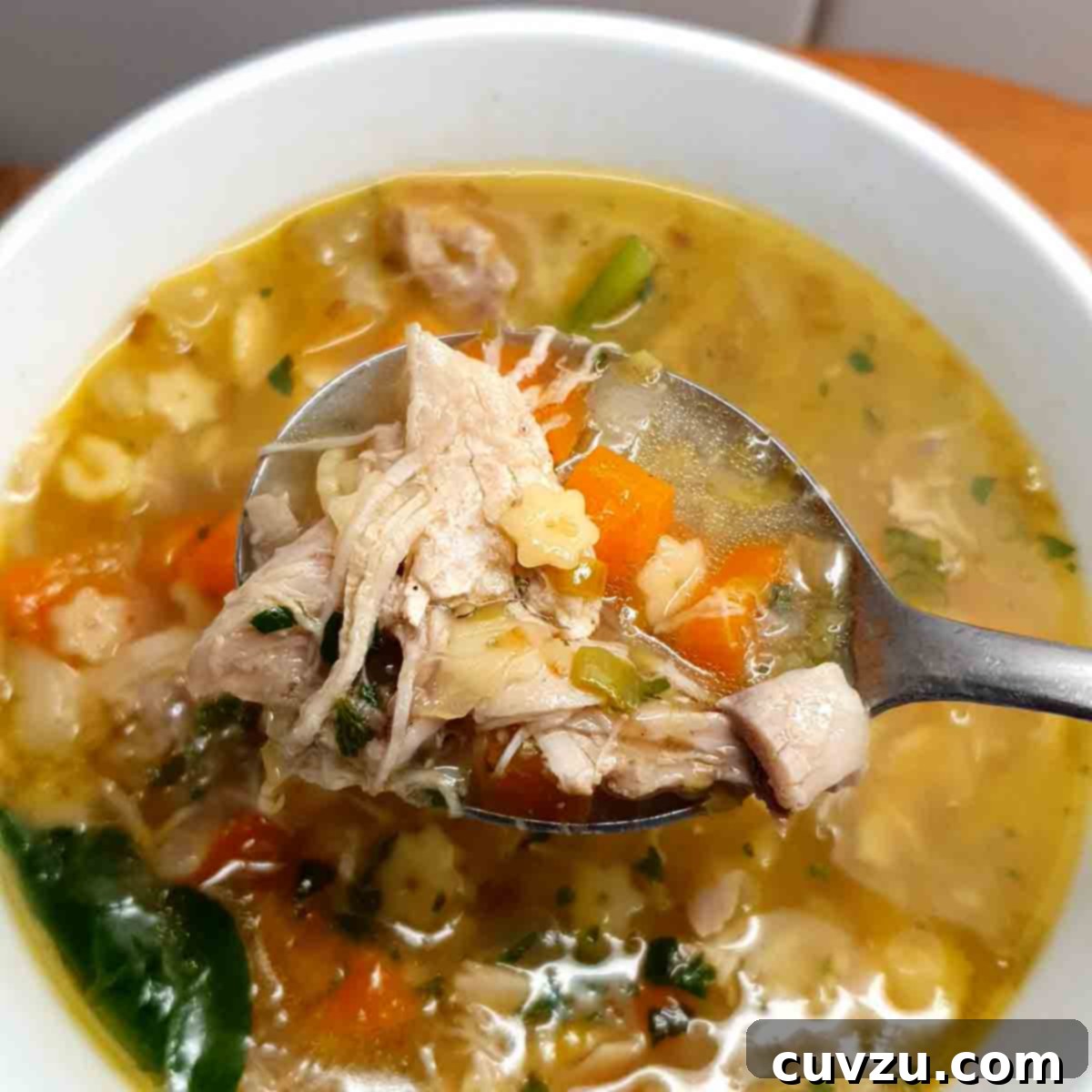 Hearty Chicken Noodle Comfort 5 A serving of classic chicken noodle soup in a white bowl, prepared by recipe tester Nicole Seguin.