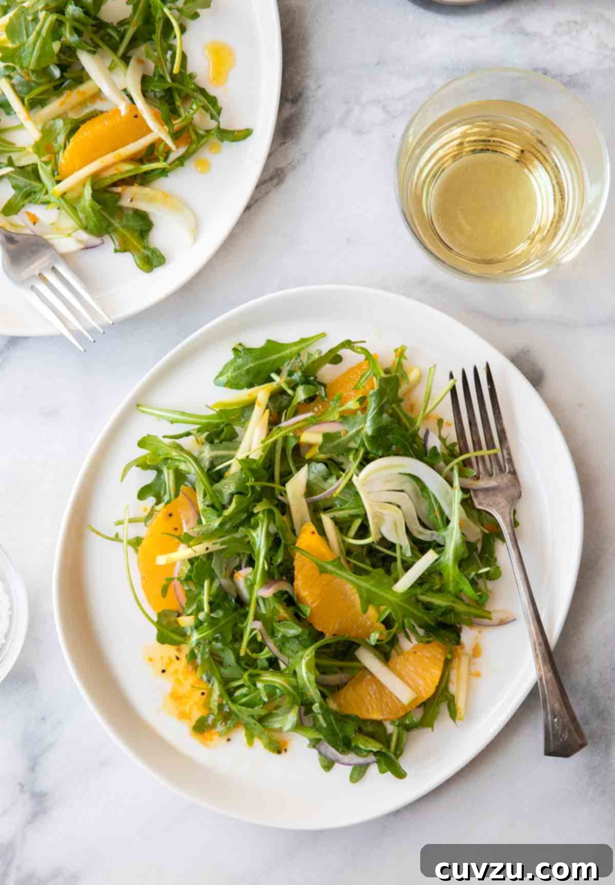 Shaved Fennel, Apple, and Orange Salad 3 A close-up shot of the refreshing Apple, Fennel, and Orange Salad, highlighting the crisp textures and bright colors of the ingredients, tossed with a delicate citrus vinaigrette.