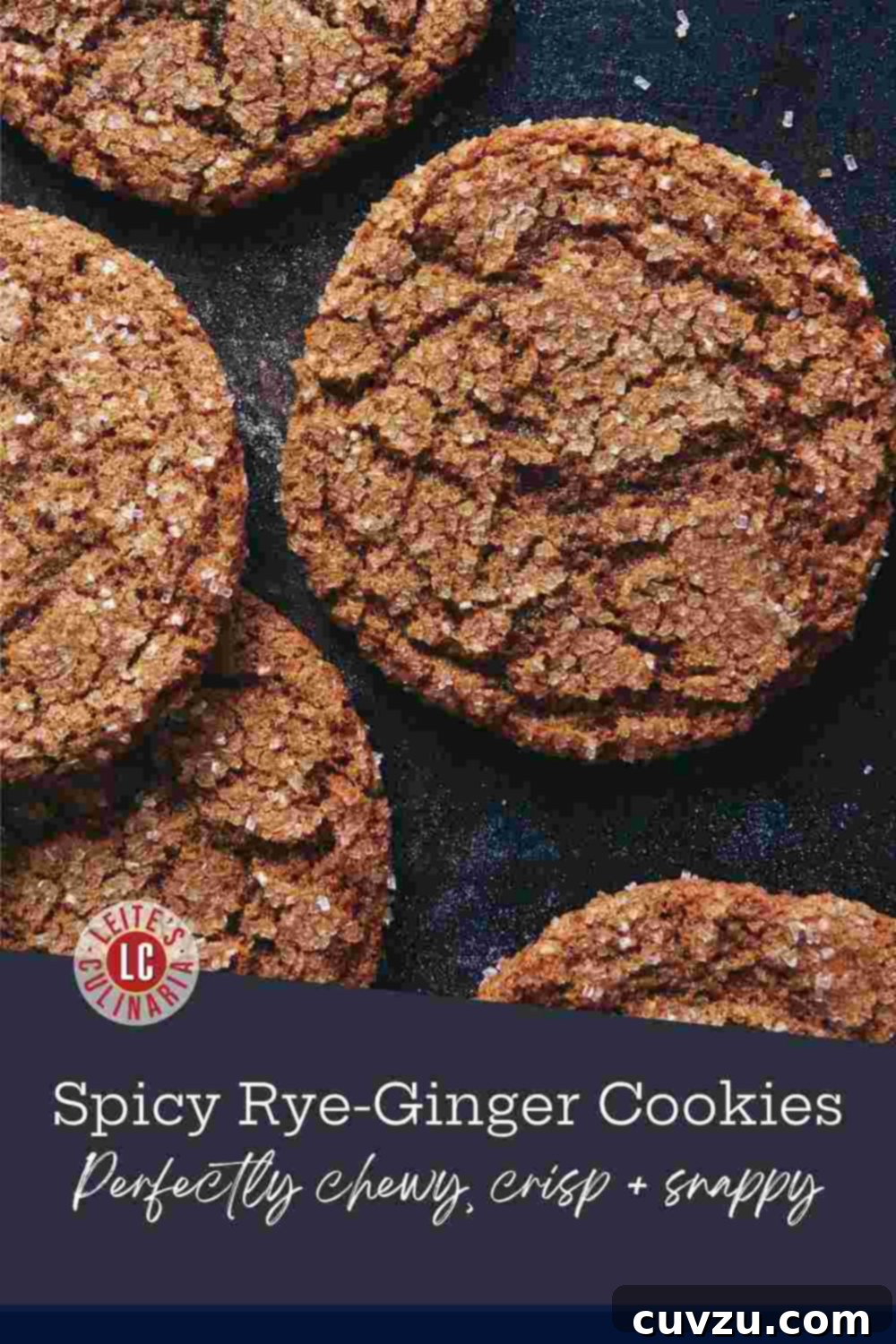 Spiced Rye Gingerbread Cookies 3 Chewy rye ginger cookies with a crackled, sparkling sugar top arranged on a dark baking sheet.