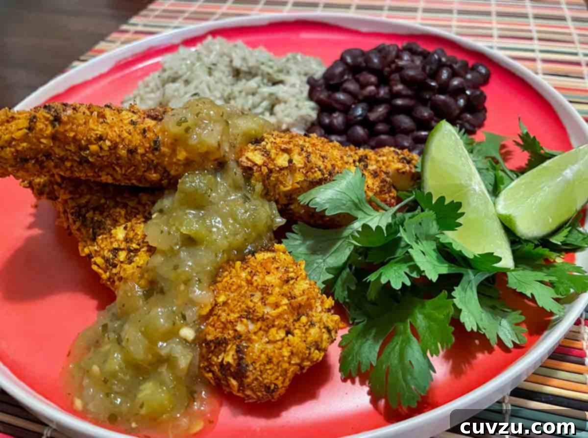 Air Fryer Tortilla Crunch Tilapia 5 Air fryer tilapia with tortilla crust on a plate with rice and beans
