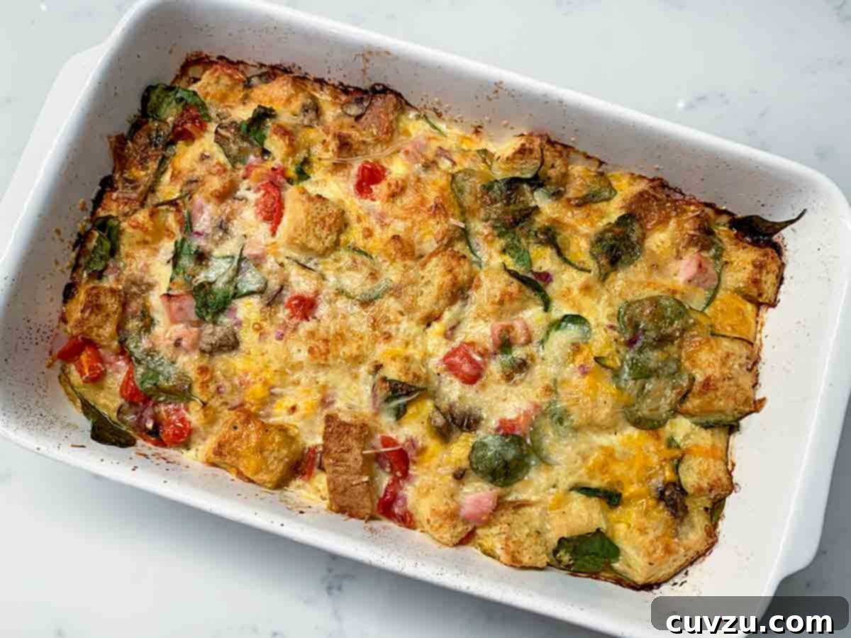 Effortless Breakfast Strata 4 A rectangular casserole dish filled with Sasha Pravdic's beautifully baked easy breakfast strata.
