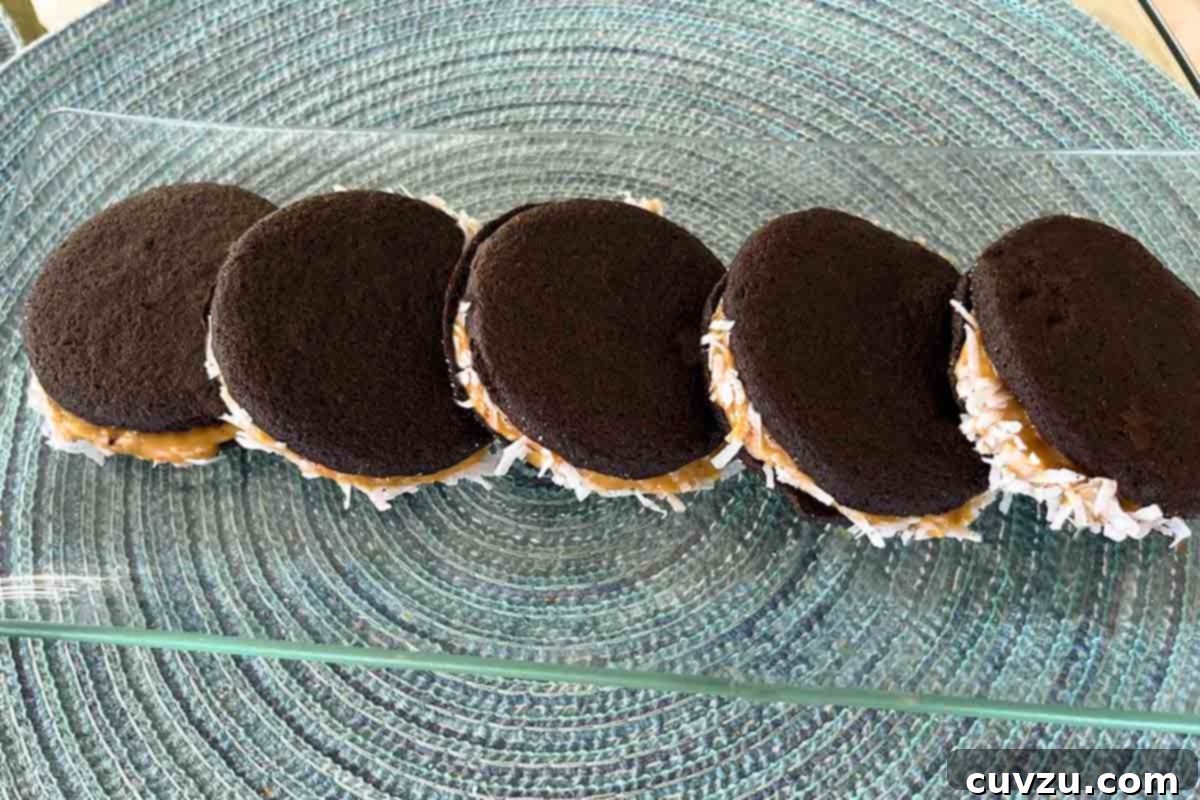 Golden Caramel Coconut Sandwiches 7 Five perfectly arranged homemade caramel coconut "Oreos" on a elegant glass platter.