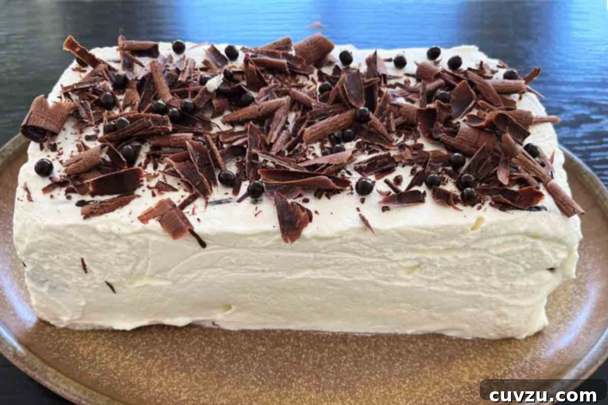 Chilled Sweet Cream Delight 6 A whole icebox cake with condensed milk whipped cream with chocolate shavings on top.