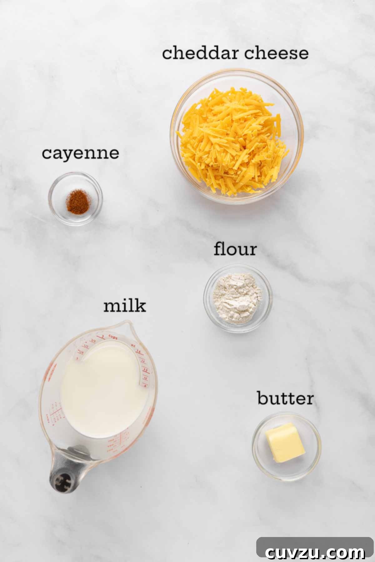 Golden Cheddar Drizzle 4 Ingredients for Cheddar cheese sauce--cheese, cayenne, flour, milk, and butter.