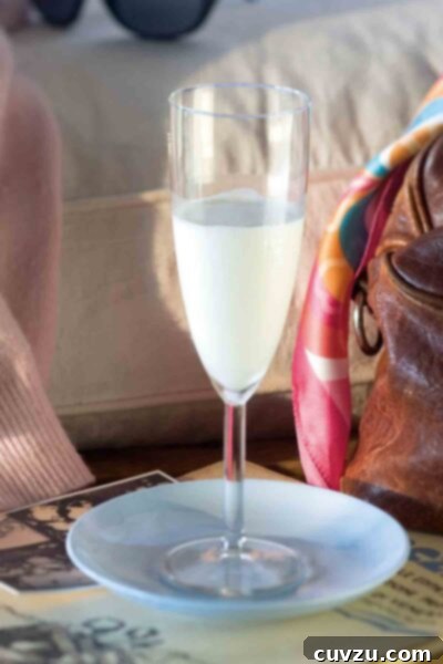 A champagne glass of Sgroppino, also called Lemon Chill, on a blue plate.