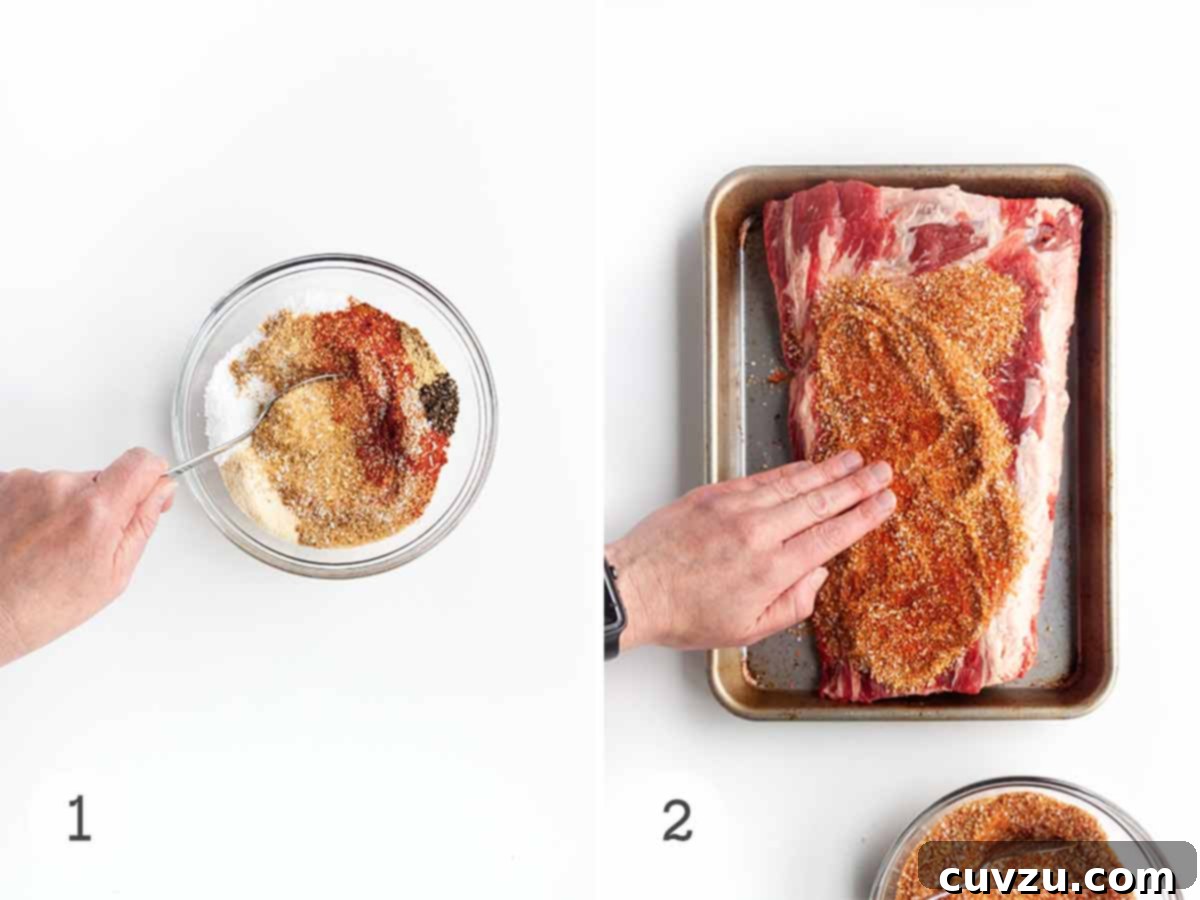 Slow-Smoked Beef Back Ribs 4 A person mixing spices in a bowl and then rubbing it onto a rack of beef ribs on a baking sheet.