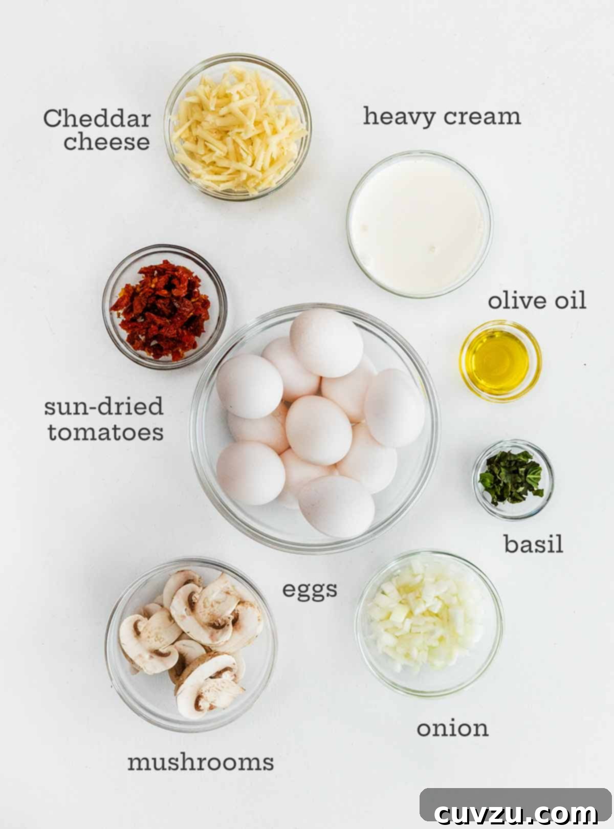 Mini Egg Power Bites 4 Eggs, cheese, sun-dried tomatoes, oil, basil, onion, and mushrooms.